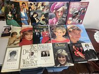 Group shot of 14 royal-themed books laid out on table