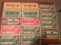 All 14 paper notes arranged: Pioneer Bonus Bucks and Canadian Tire money