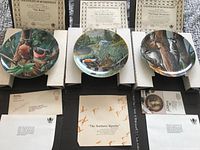 All three plates with corresponding certificates and paperwork displayed