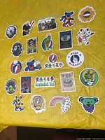 All 23 stickers spread on yellow surface