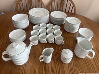 Entire 104-piece Athena dinnerware set arranged on table