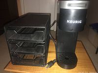 Front view of Keurig coffee maker beside 3-drawer mesh organizer