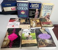 All ten books laid out front and back rows