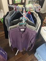 Front view of all 12 shirts on rack