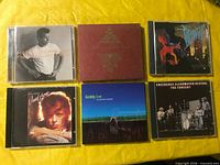 All six CD cases front covers visible