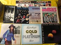 All nine album covers laid out for identification