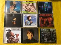 All nine CD fronts laid out in 3×3 grid