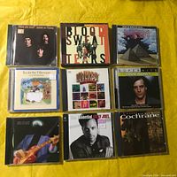 Overall view of 9 CDs arranged in 3x3 grid