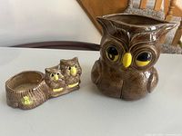 Large owl pitcher and small double-owl planter shown together