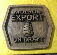 Front view showing full plaque, raised lettering and ship motif