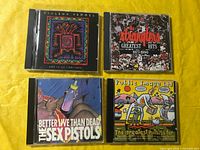 All four CD fronts displayed