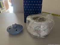 Warmer with lid, bubble-wrapped, box visible