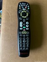 Full view of Rogers black universal remote showing entire button layout and logo