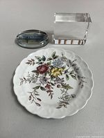 Group shot showing plate, crystal block, and paperweight