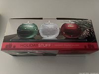 Retail box showing three ornament tealight holders