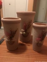 Three textured ceramic vases on table
