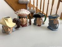Group shot of all four ceramic character jugs