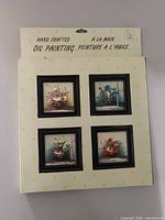 Retail package showing all four framed oil paintings