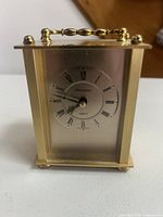 Front view of gold-tone President quartz carriage clock