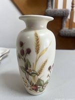 Front view of porcelain bud vase showing Harvest motif