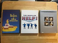 Front view of three Beatles DVD cases