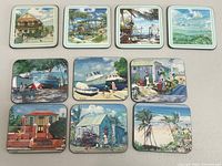All ten square coasters laid out; shows artwork variety and condition