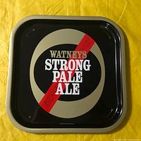 Front of square Watneys tray showing logo and colour scheme