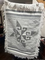 Full front view of rug showing pattern and fringe