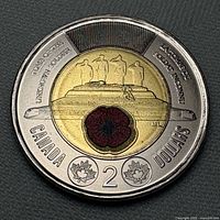 Reverse side showing Tomb of the Unknown Soldier design and red poppy