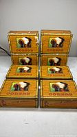 Stack of eight Coreah cigar boxes showing quantity and general exterior
