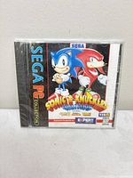 Front of sealed jewel case showing artwork, Sega PC Collection branding, ESRB rating, Y2K compliant label