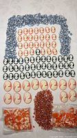 Overview of all cameo cabochons arranged by type with bagged pieces