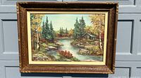 Front view of framed landscape oil painting