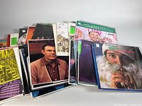 Group shot of assorted vinyl record albums partially fanned