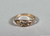 Top view showing openwork heart/leaf pattern on ring
