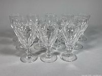 Front angled view showing all twelve Waterford cut crystal stemware glasses