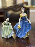 Front view of both Melanie and Fair Maiden figurines