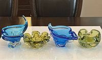 Group shot of four art glass bowls