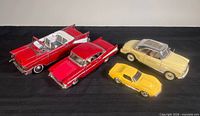 All four die-cast cars grouped for scale and colour overview