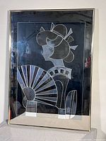 Front view of framed mirrored artwork showing full design