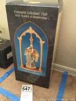 Front of original Fontanini box showing Estella with Cathedral Arch figurine under an arch, labeled as 2003 Symbol of Membership.