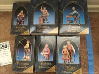 Six Fontanini villager figurines in original boxes displayed together, showing front of boxes with names Abigail and Peter, Obediah, Jacob, Emanuele, Orion, and Herschel.
