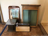 Photo showing all three main items: vintage washboard, kitchen scale, and wooden tray positioned upright.