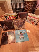 Group of displayed records and box showing quantity and variety