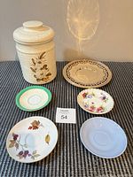 Group shot of canister, tray and four saucers