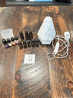 Complete lot showing diffuser, oils, cup, power cord