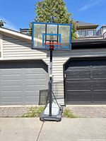 Full view of Spalding portable basketball system assembled curbside