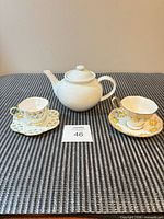 Full view of teapot and two teacup/saucer sets