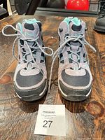 Front view of both boots showing uppers and lacing