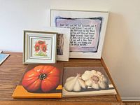 Overview of five art pieces on table